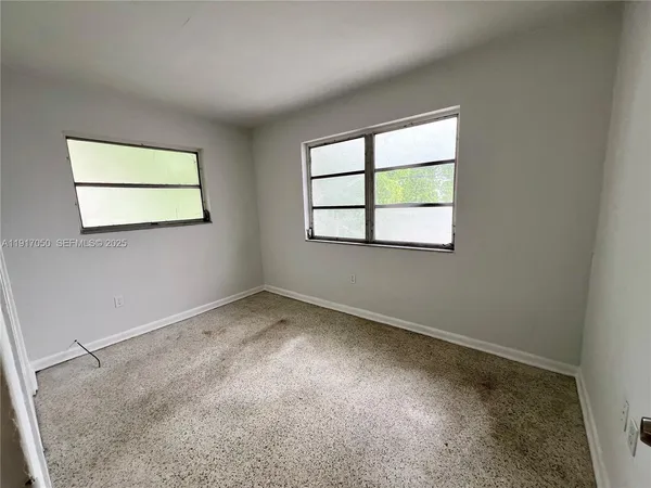 an empty room with windows