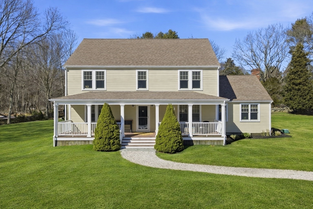24 Ridge Hill Road Scituate, MA 02066 - Photo 1 of 38 a front view of a house with a yard table and chairs