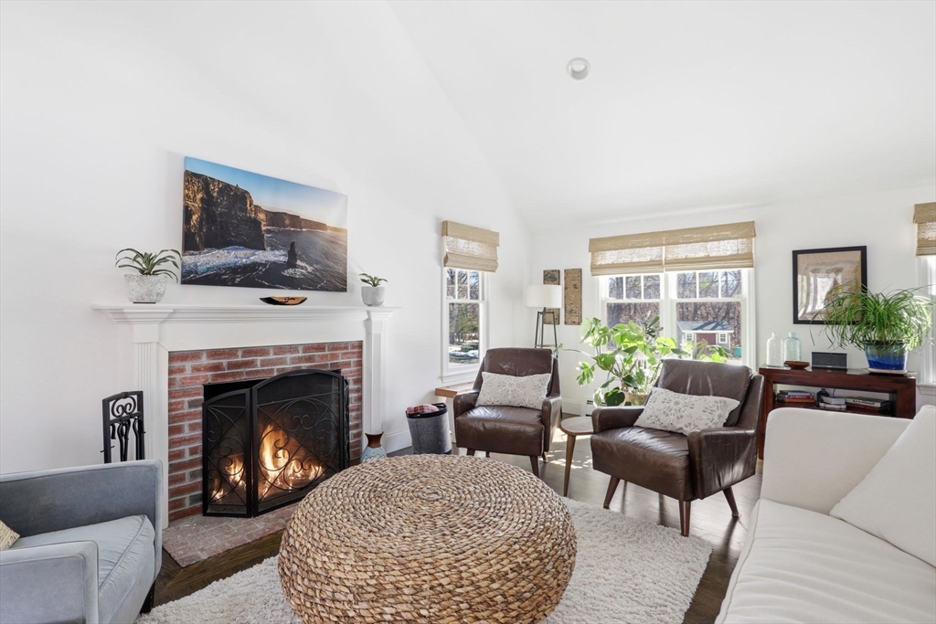 24 Ridge Hill Road Scituate, MA 02066 - Photo 13 of 38 a living room with furniture and a fireplace