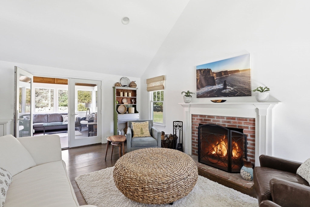 24 Ridge Hill Road Scituate, MA 02066 - Photo 14 of 38 a living room with furniture and a fireplace