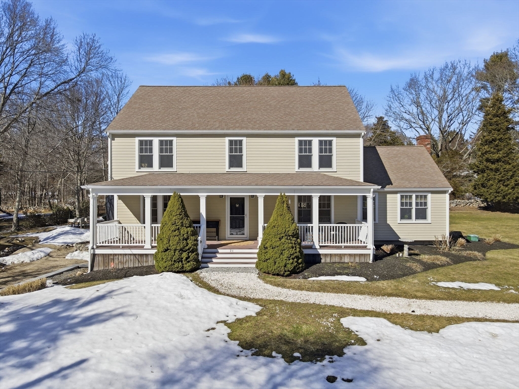 24 Ridge Hill Road Scituate, MA 02066 - Photo 2 of 38 a front view of a house with a yard