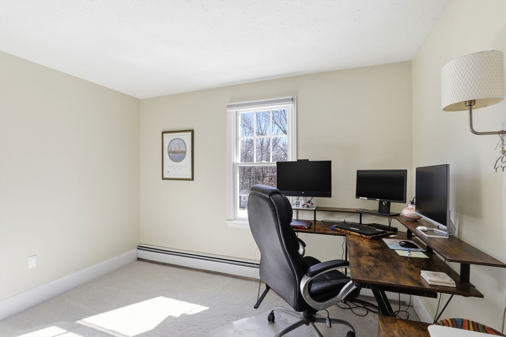 24 Ridge Hill Road Scituate, MA 02066 - Photo 25 of 38 a view of a workspace with furniture and a window