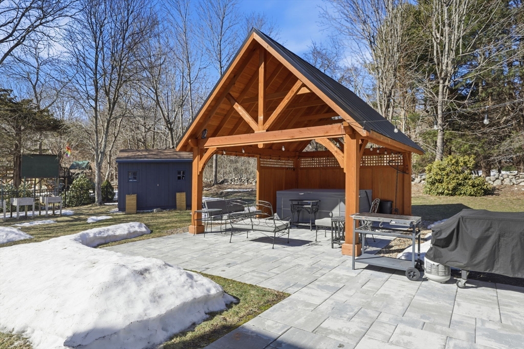 24 Ridge Hill Road Scituate, MA 02066 - Photo 32 of 38 a backyard of a house with seating space