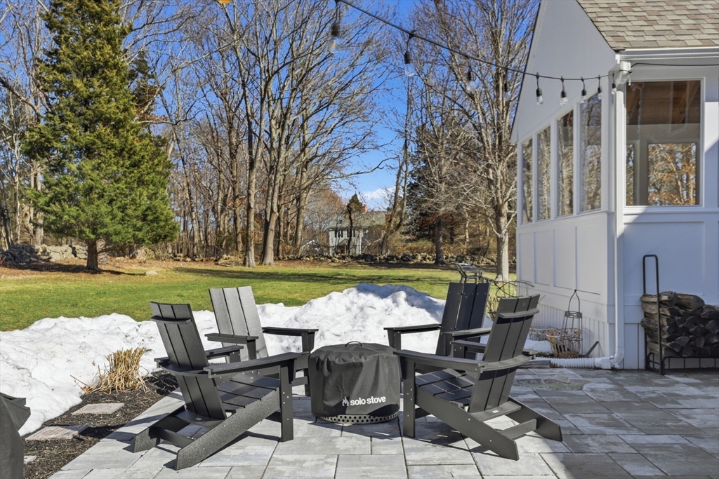 24 Ridge Hill Road Scituate, MA 02066 - Photo 33 of 38 a view of a patio with chair and table on the patio