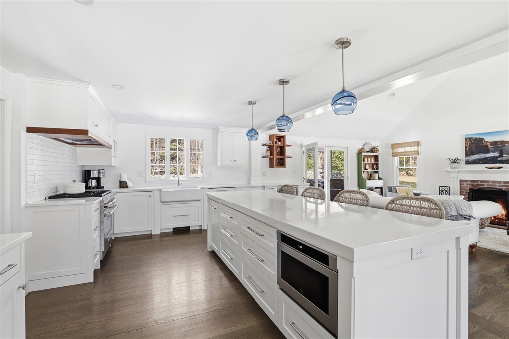 24 Ridge Hill Road Scituate, MA 02066 - Photo 6 of 38 a kitchen with stainless steel appliances granite countertop a sink stove and refrigerator
