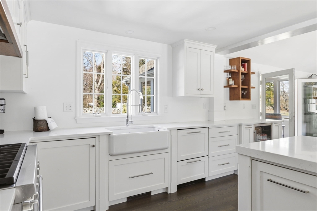 24 Ridge Hill Road Scituate, MA 02066 - Photo 7 of 38 a kitchen with white cabinets and a window