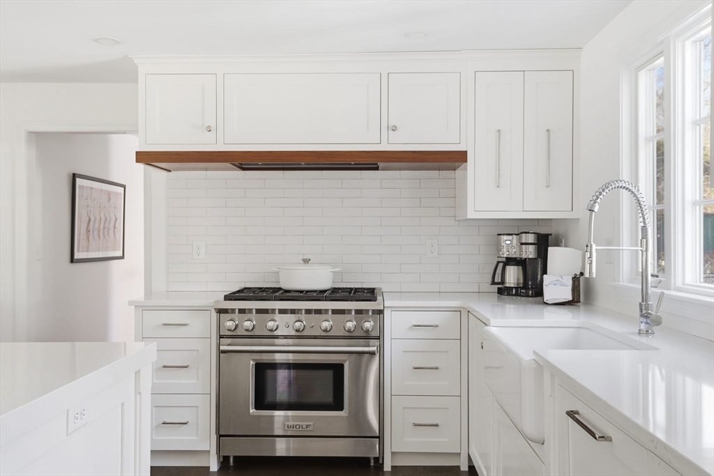24 Ridge Hill Road Scituate, MA 02066 - Photo 8 of 38 a kitchen with granite countertop white cabinets and white stove