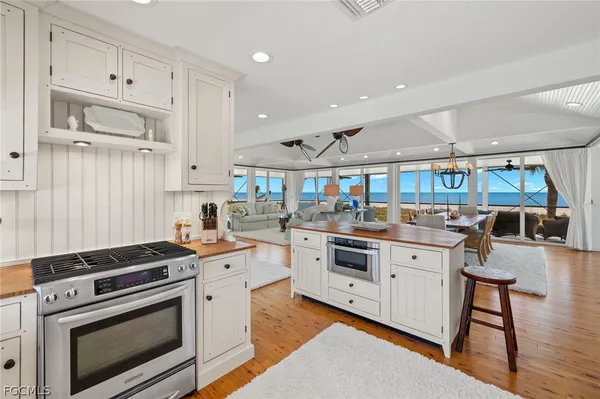 a kitchen with stainless steel appliances granite countertop a stove and a sink