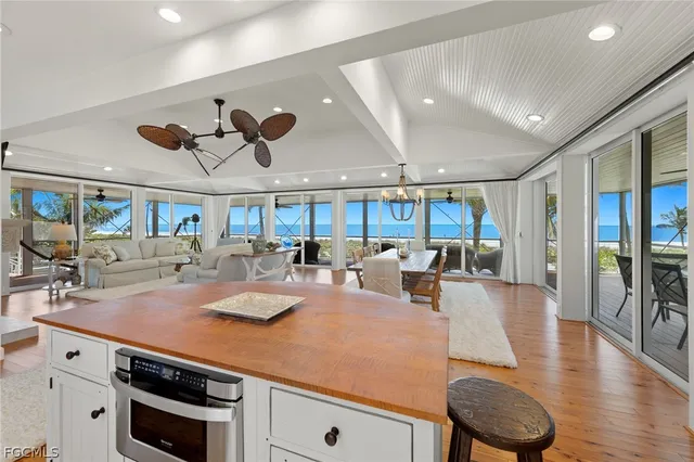 a large kitchen with a table and chairs