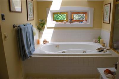 270 Stage Harbor Road Chatham, MA 02633 - Photo 13 of 21 a bath tub sitting next to a window