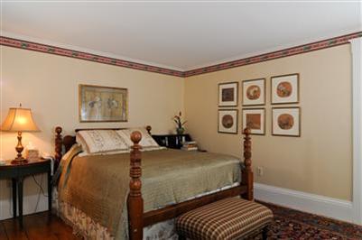 270 Stage Harbor Road Chatham, MA 02633 - Photo 17 of 21 a bed room with a bed and a lamp