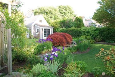 270 Stage Harbor Road Chatham, MA 02633 - Photo 20 of 21 a aerial view of a house with a yard and garden