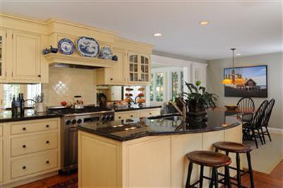 270 Stage Harbor Road Chatham, MA 02633 - Photo 9 of 21 a kitchen with stainless steel appliances a counter space a sink and cabinets
