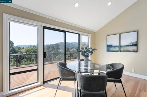 a kitchen with stainless steel appliances granite countertop a sink a stove and refrigerator