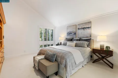 a bathroom with a bathtub a sink a toilet and a window