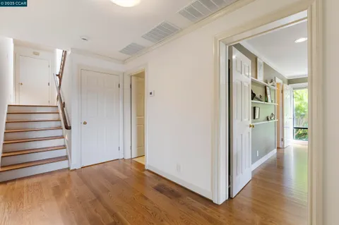 a roof deck with wooden floor and outdoor seating