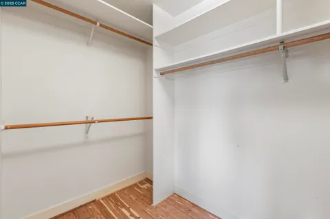 an aerial view of a house with balcony and trees al around