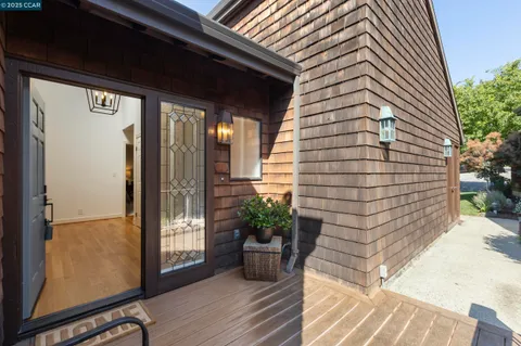 a view of an entryway with wooden floor