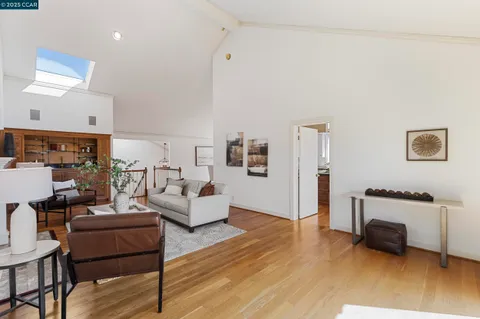 a view of a chairs and table in the balcony