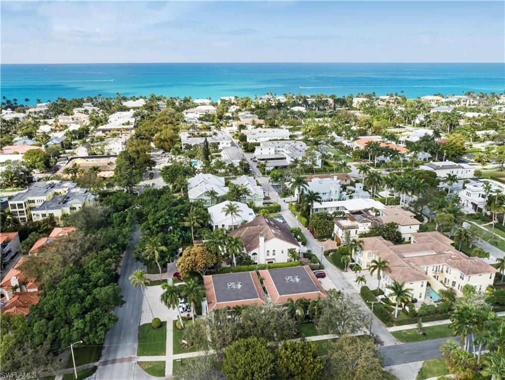 284 4th Street South, Unit 103 Naples, FL 34102 - Photo 2 of 11 an aerial view of residential building and lake