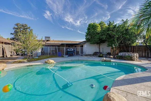 a view of a swimming pool with a patio