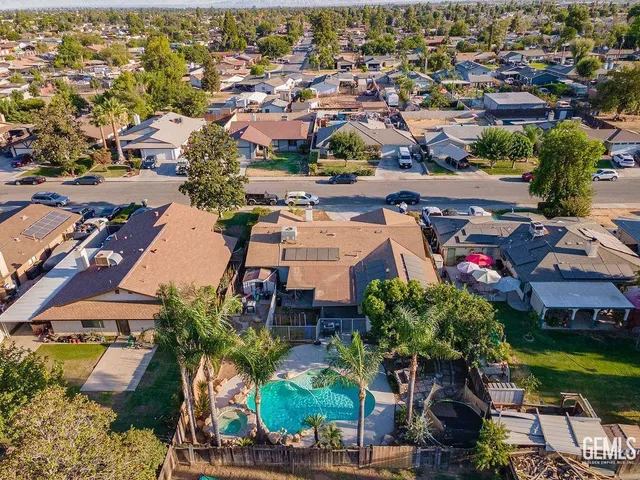 an aerial view of residential houses with outdoor space