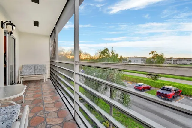 a view of swimming pool from a balcony