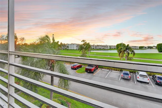 a view of swimming pool with an outdoor seating