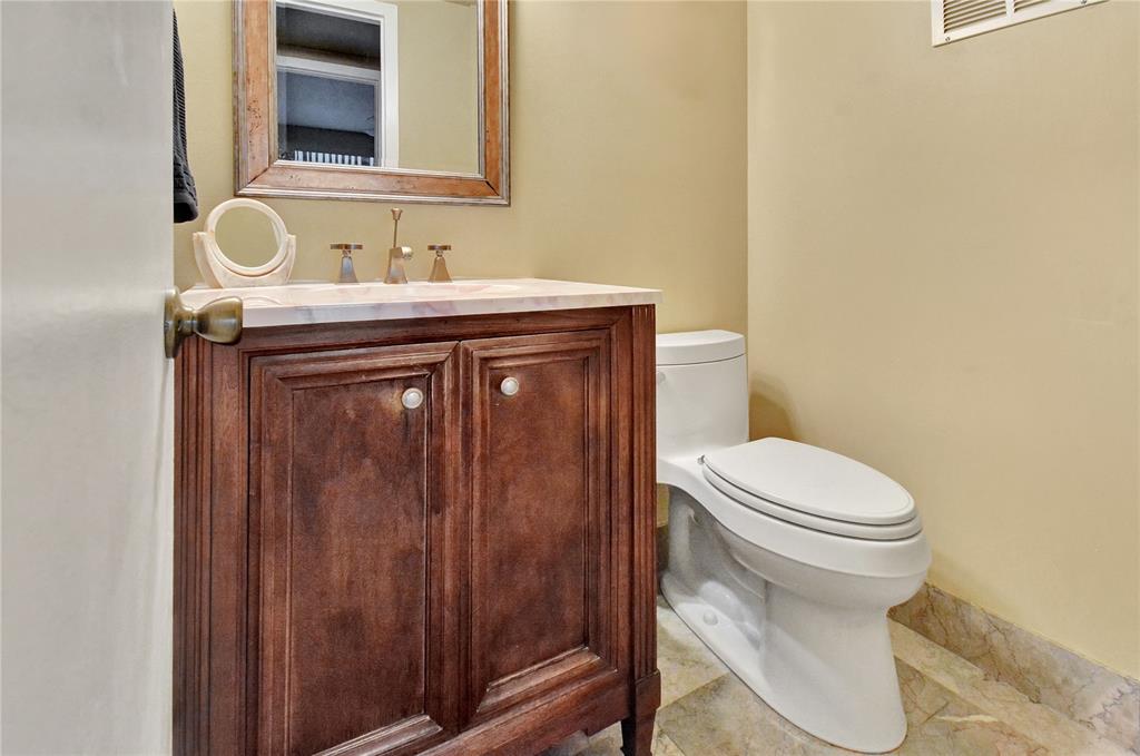 33 Fanshaw A, Unit 33 Boca Raton, FL 33434 - Photo 13 of 16 a bathroom with a sink and a toilet