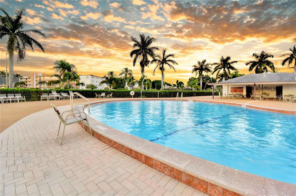 33 Fanshaw A, Unit 33 Boca Raton, FL 33434 - Photo 16 of 16 a view of a swimming pool with a lounge chairs