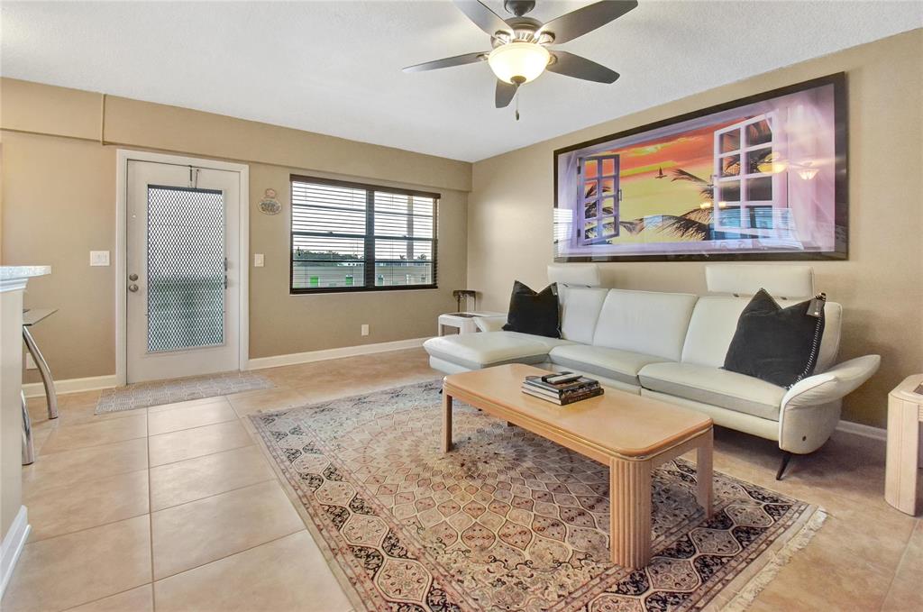33 Fanshaw A, Unit 33 Boca Raton, FL 33434 - Photo 3 of 16 a living room with furniture and a window
