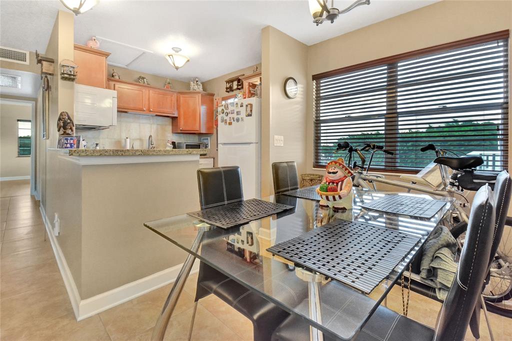 33 Fanshaw A, Unit 33 Boca Raton, FL 33434 - Photo 4 of 16 a view of a dining room with furniture