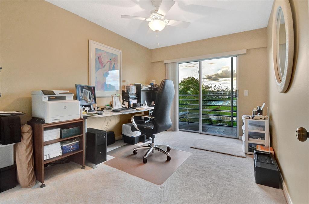 33 Fanshaw A, Unit 33 Boca Raton, FL 33434 - Photo 10 of 16 a view of a livingroom with workspace and a window