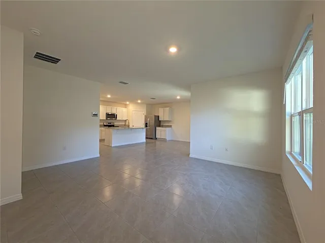 a view of a livingroom with a kitchen
