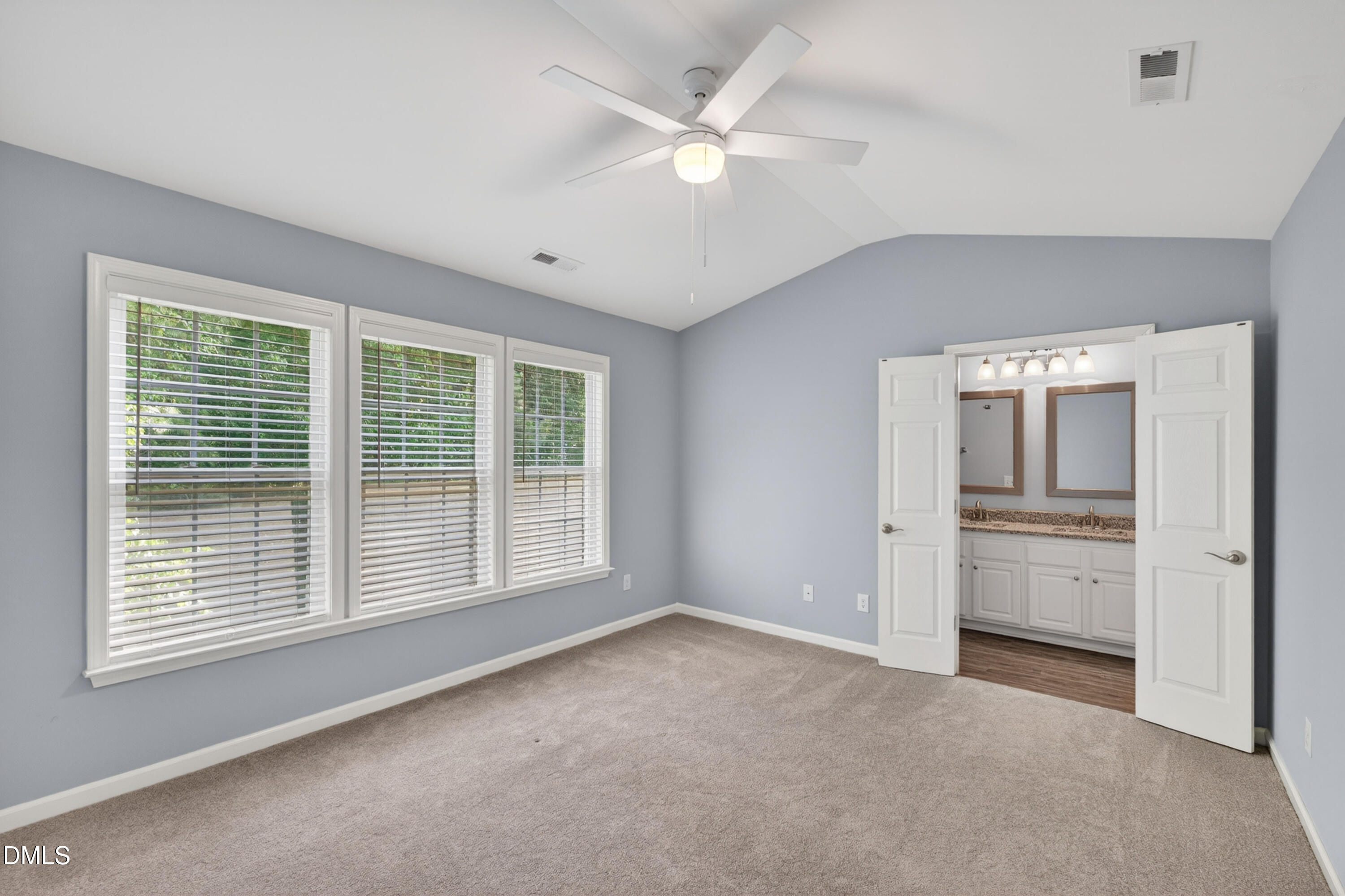 5421 Golden Arrow Lane Raleigh, NC 27613 - Photo 27 of 49 a view of an empty room with a window and kitchen view