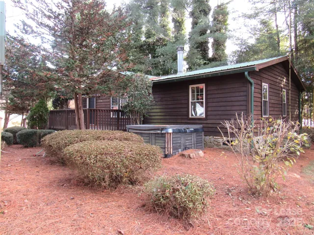 a view of backyard with a large tree