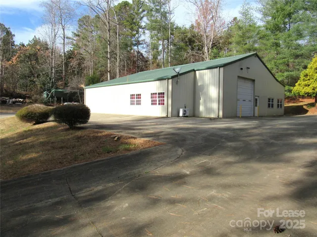 a view of a car park in front of house