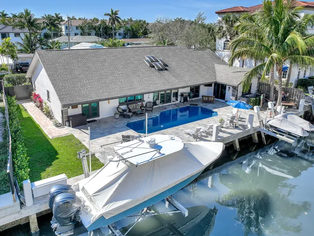 a aerial view of a house with swimming pool and patio