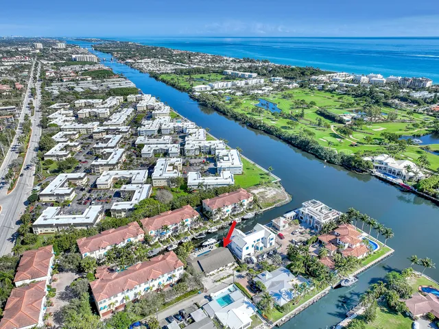 an aerial view of a house with garden space and sitting area