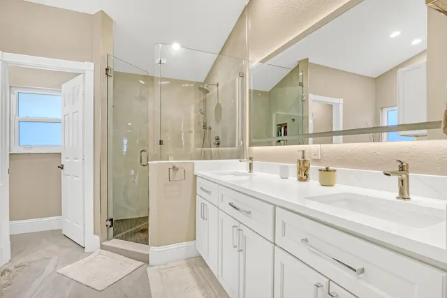 a bedroom with a bed and a mirror