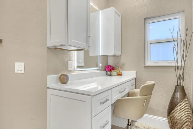 a bedroom with furniture and a flat screen tv