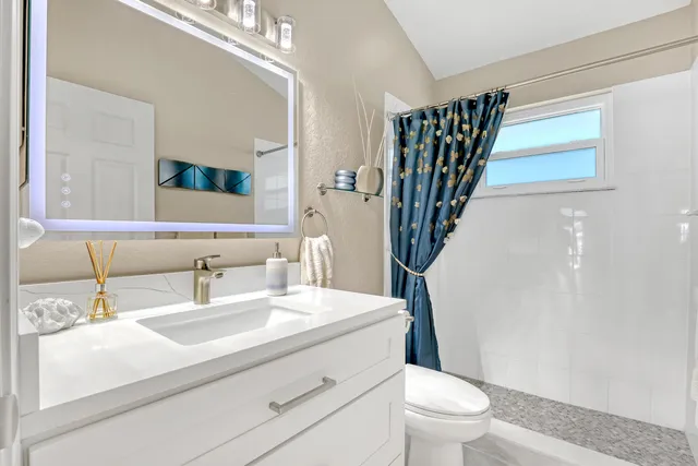 a view of a living room and chandelier