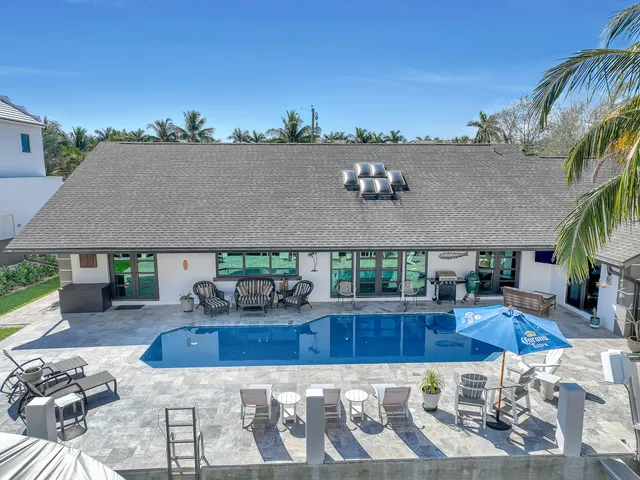 a view of potted plants in front of a window
