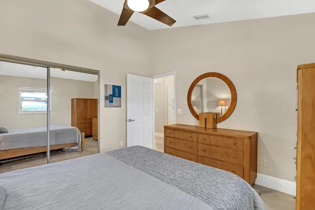 a view of a house with backyard and patio