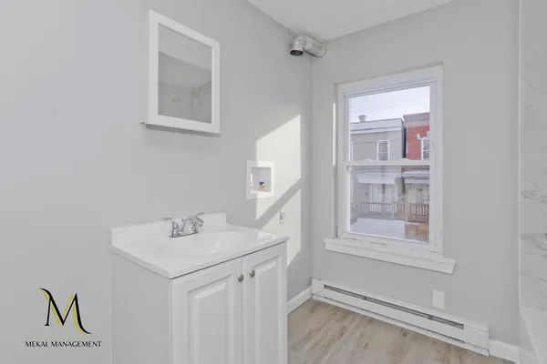 a bathroom with a sink and a mirror