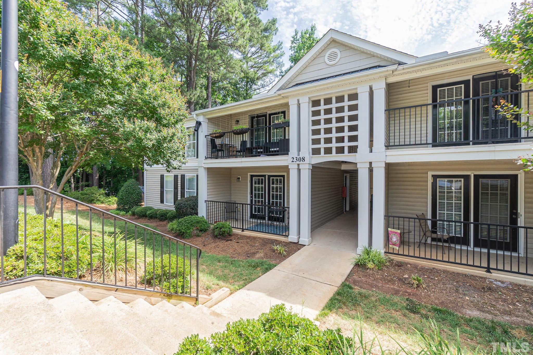 2308 Myron Drive, Unit 203 Raleigh, NC 27607 - Photo 1 of 26 a front view of a house with a porch