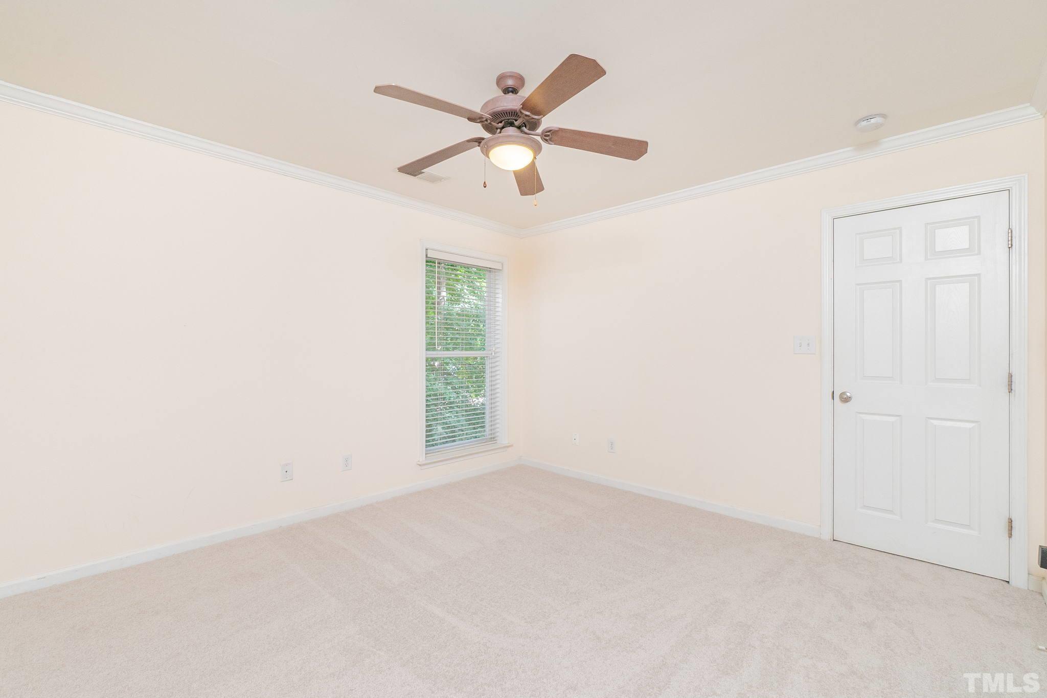 2308 Myron Drive, Unit 203 Raleigh, NC 27607 - Photo 17 of 26 an empty room with window and ceiling fan