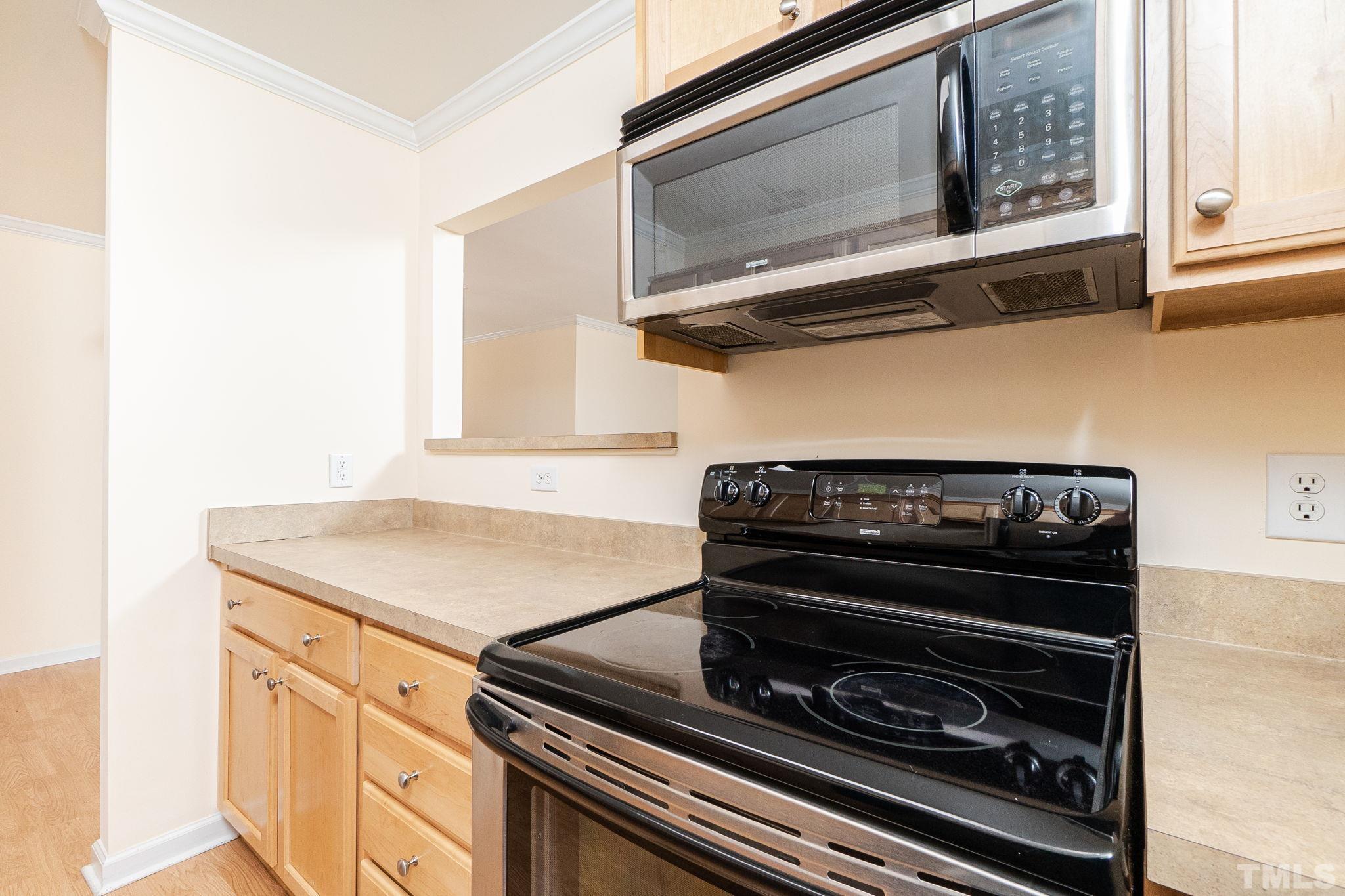 2308 Myron Drive, Unit 203 Raleigh, NC 27607 - Photo 10 of 26 a stove top oven sitting inside of a kitchen