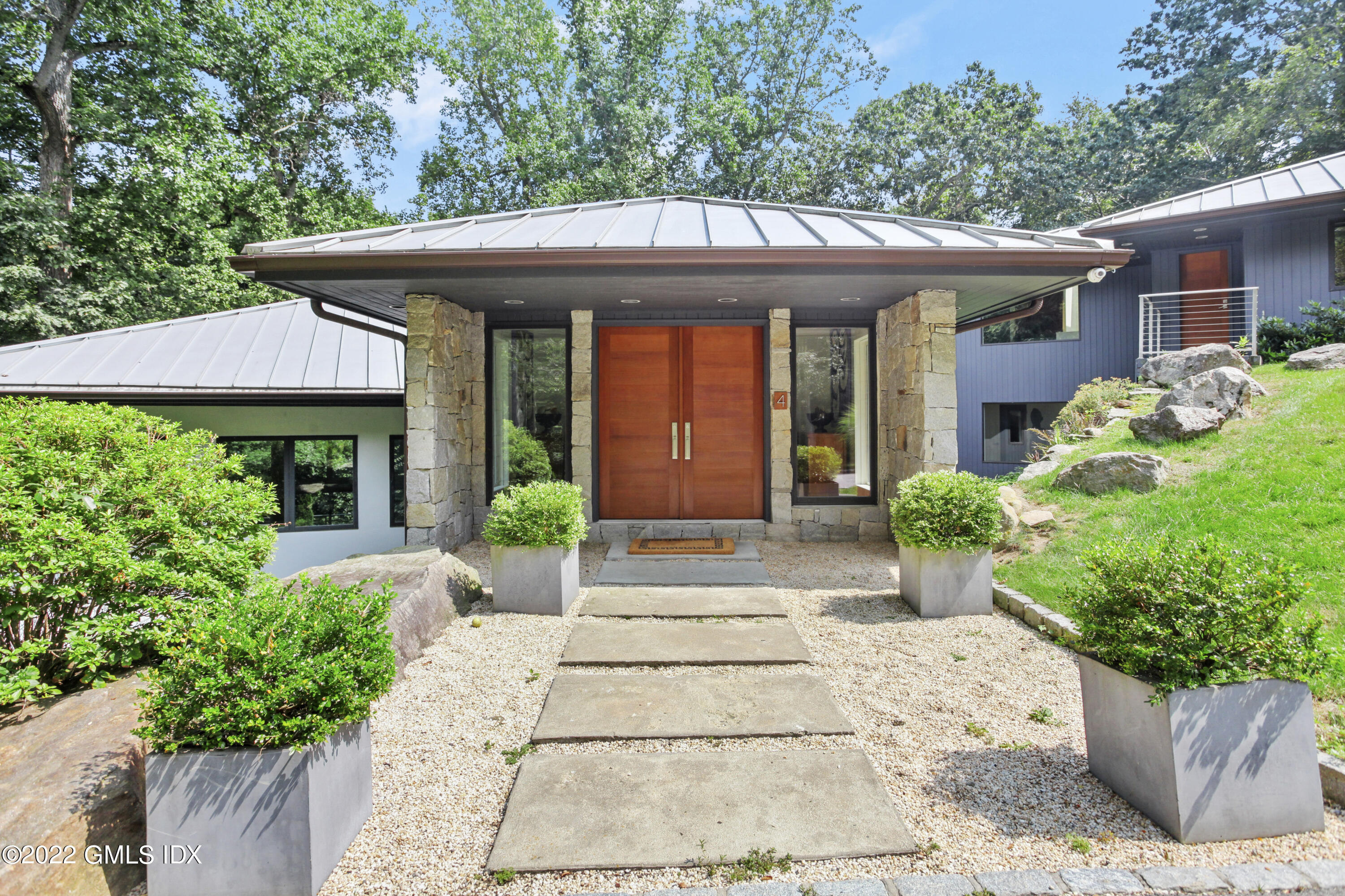 a front view of a house with garden