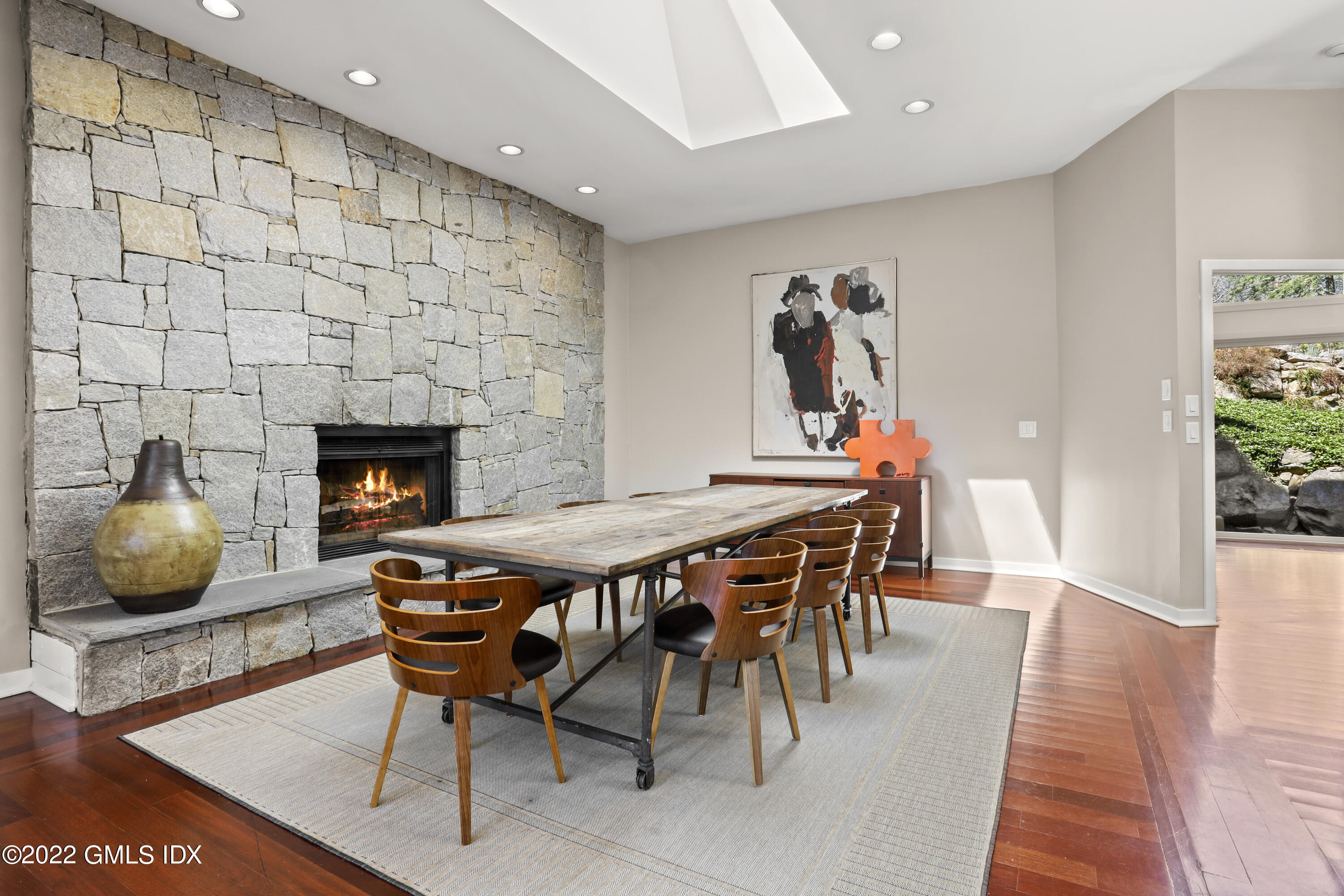 4 Chateau Ridge Road Greenwich, CT 06831 - Photo 19 of 37 a dining room with furniture and wooden floor